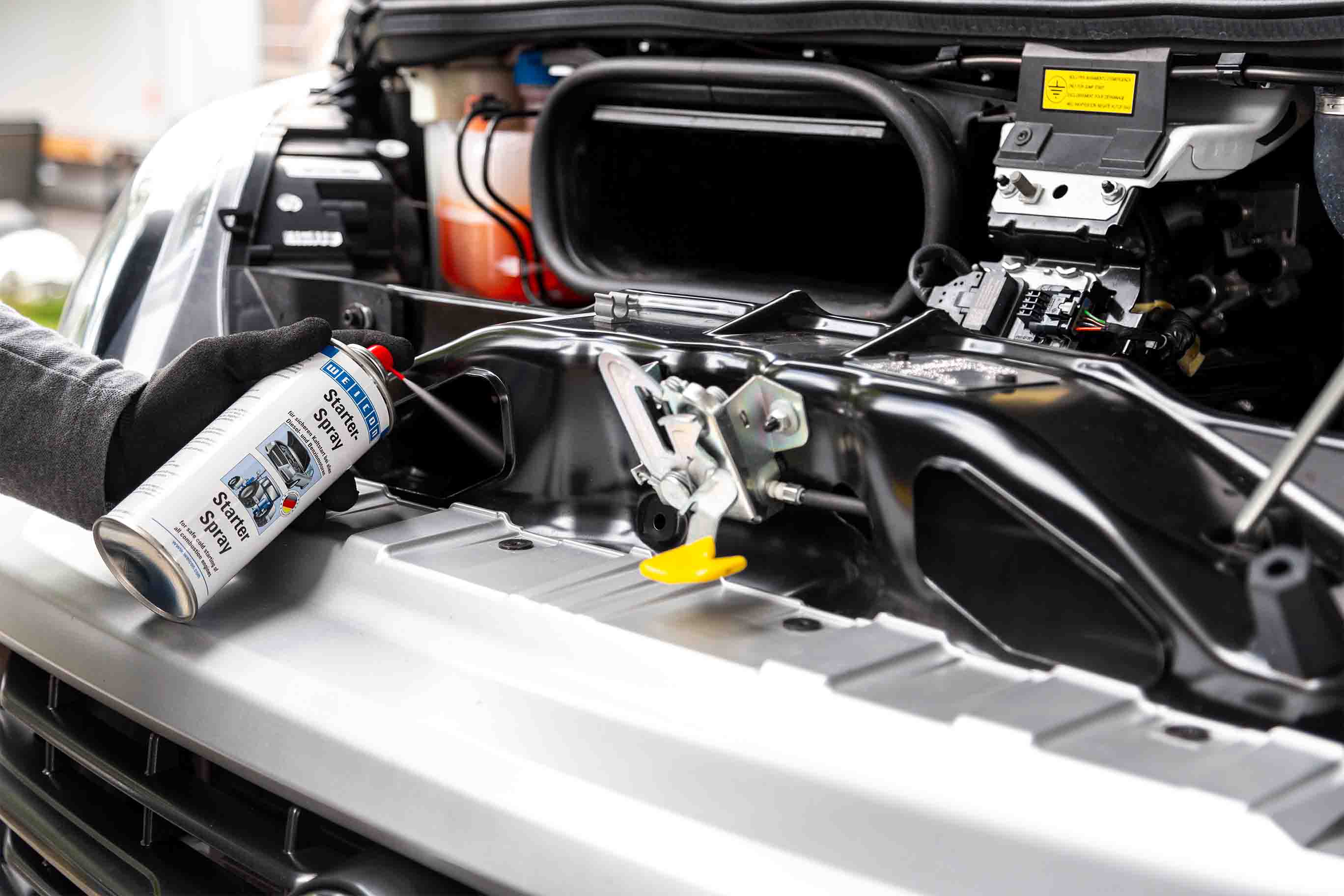 starter spray, car maintenance, engine bay, spray can, open hood